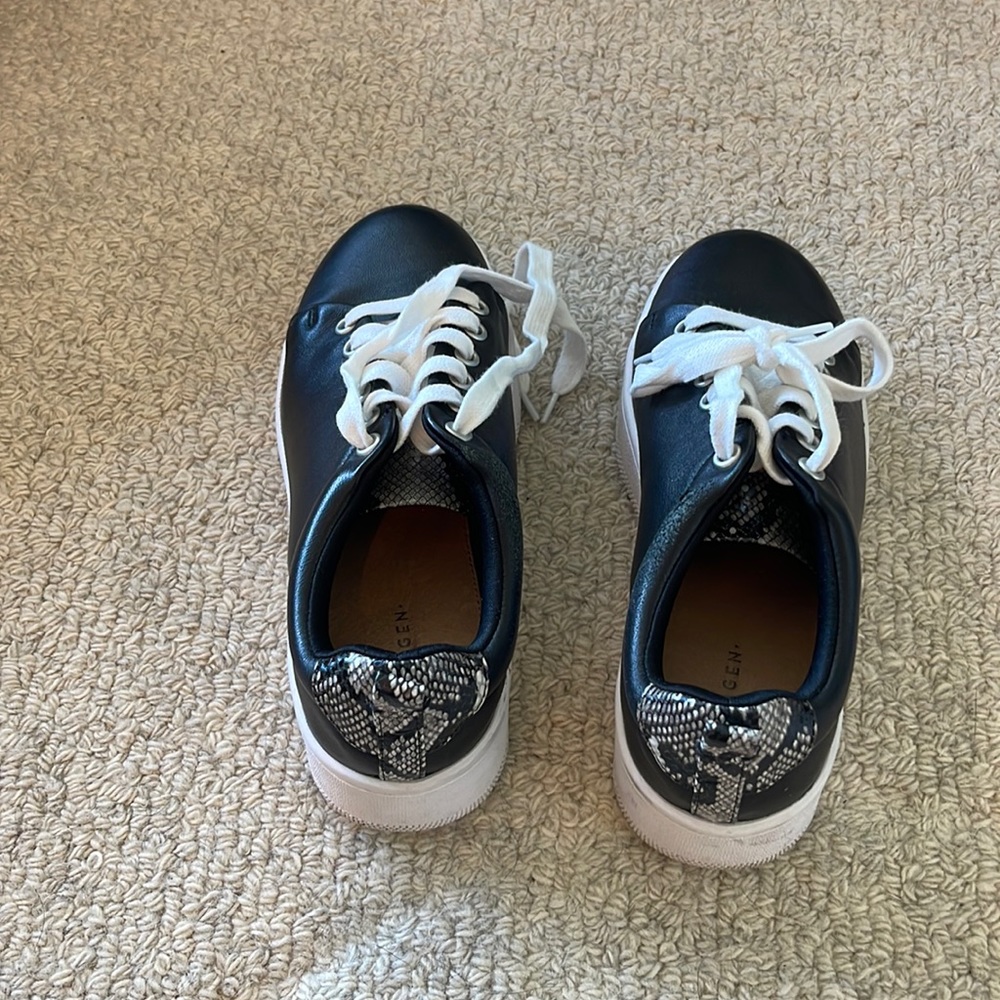 Black sneakers with snake skin on back!